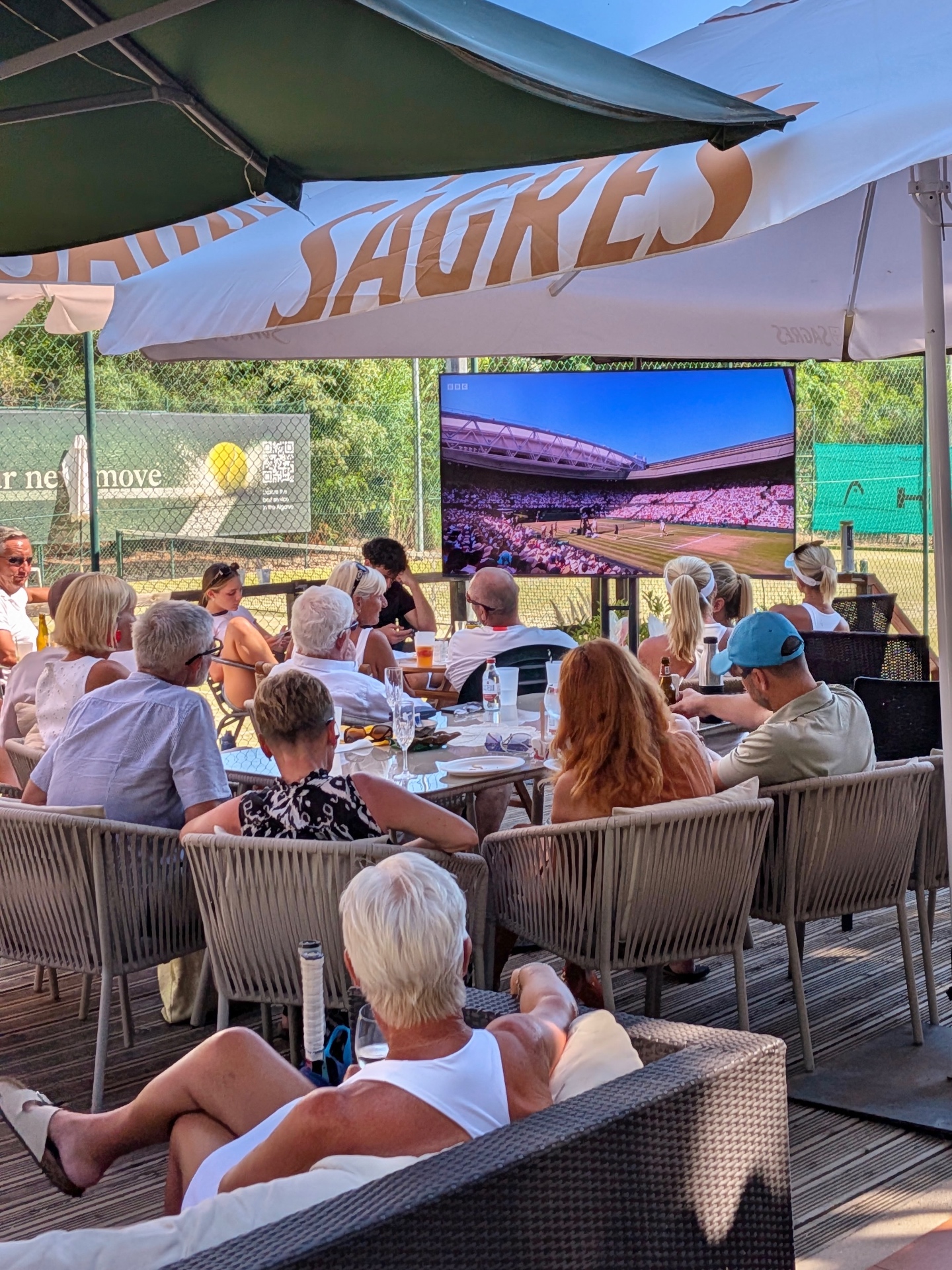 Members watching Wimbledon on the clubhouse terrace