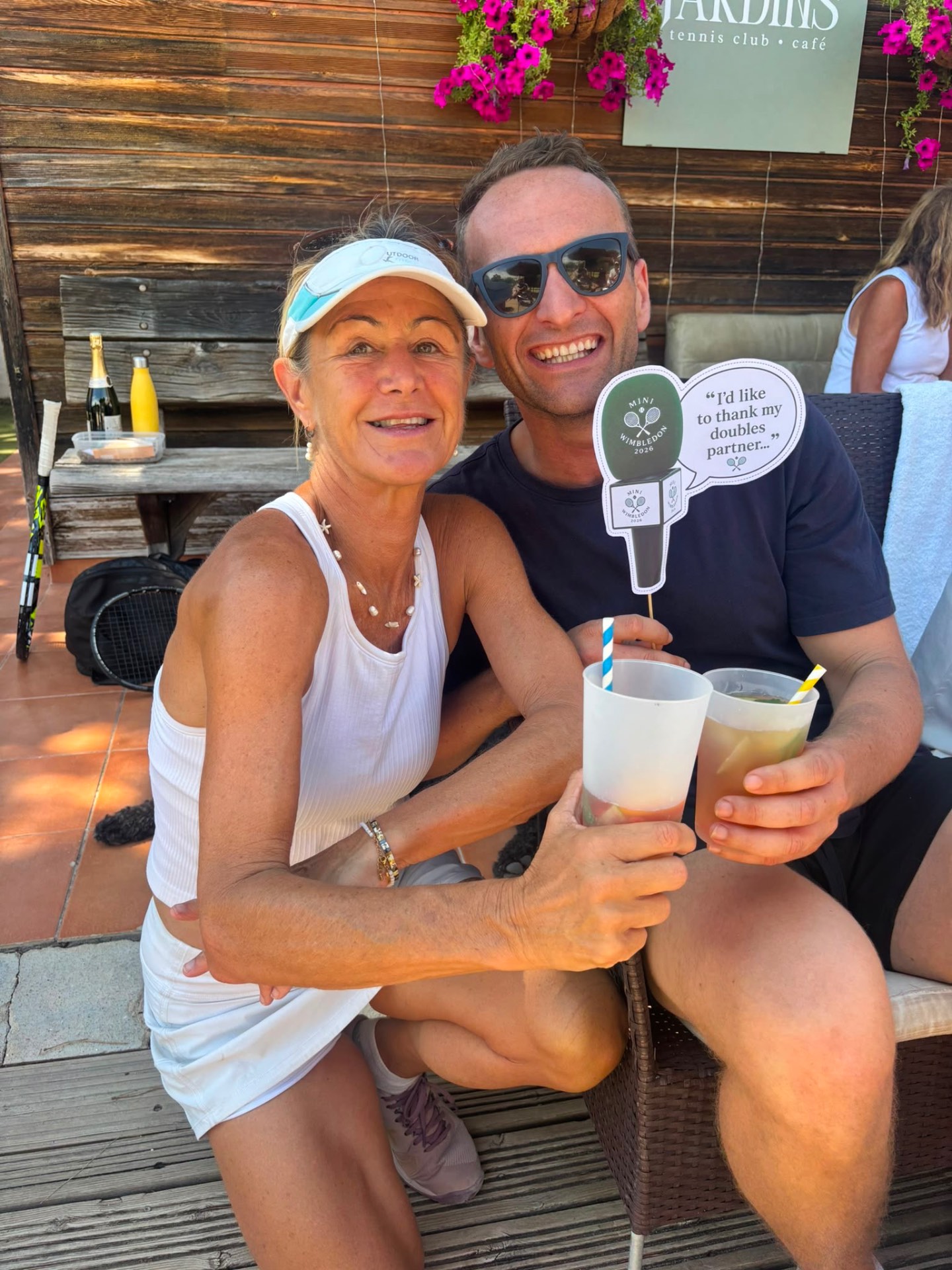 Doubles partners enjoying drinks at the clubhouse