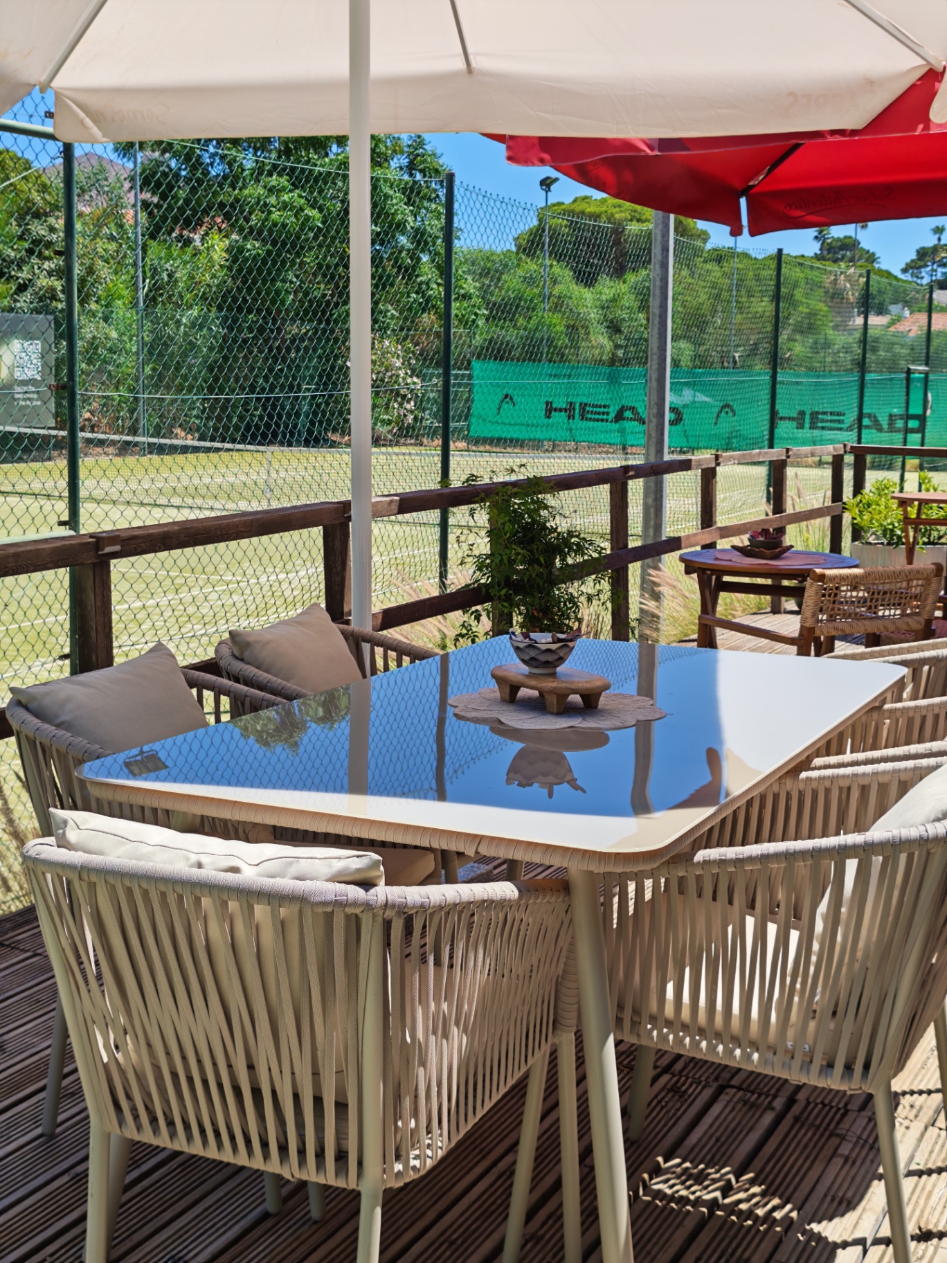 The Deck terrace overlooking the tennis courts